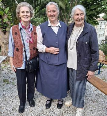 A group of older women standing together

AI-generated content may be incorrect.