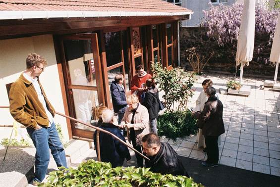 A group of people outside a building

AI-generated content may be incorrect.